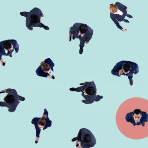 Businesspeople walk on a light blue floor; one stands in a red Appreciative Inquiry circle.