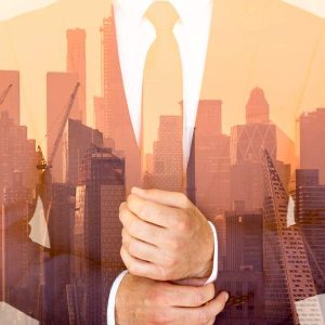 Man in suit blended with skyscrapers and cranes; text reads “Entrepreneurship - Self Study.”.