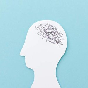 Paper head cutout with scribbles on blue background, text: “Managing Workplace Anxiety - Self Study”.
