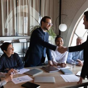 Five businesspeople meeting at a table, Middle Manager - Self Study program featured prominently.