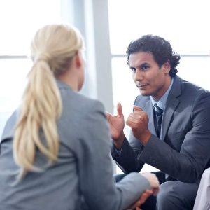 Business professionals talk Office Politics for Managers-Self Study in a modern office.